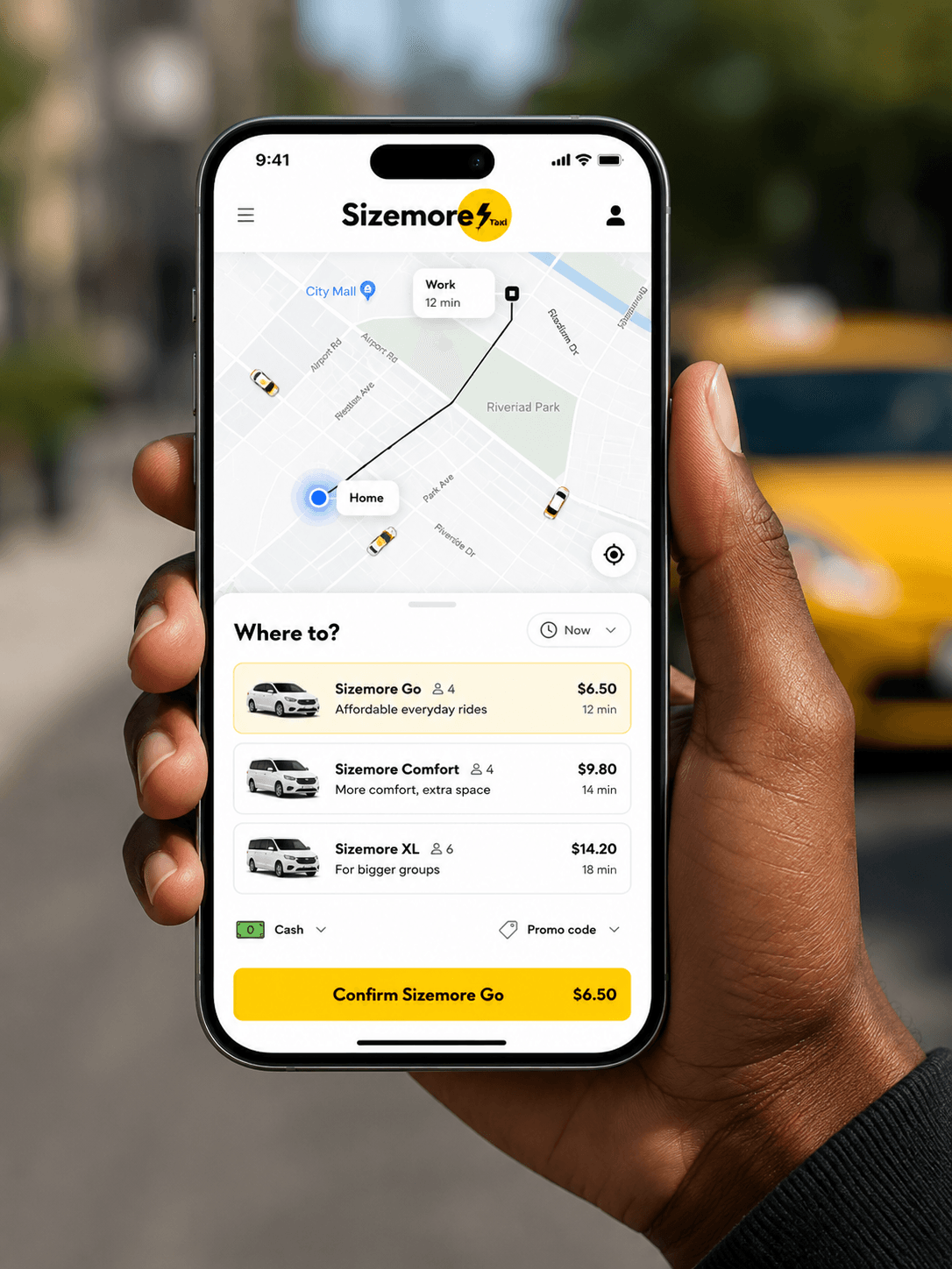 Sizemore Taxi mobile app in hand